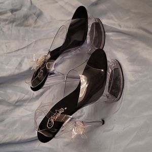 Clear pleaser heels with cutout of platform